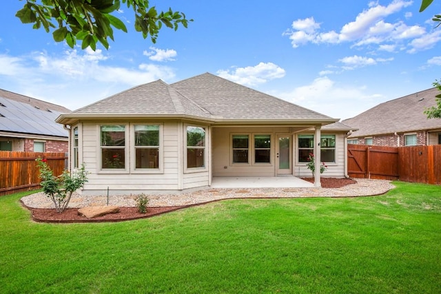104 N Pasture Cv, Hutto, TX 78634 - back of house featuring a patio and roof with shingles