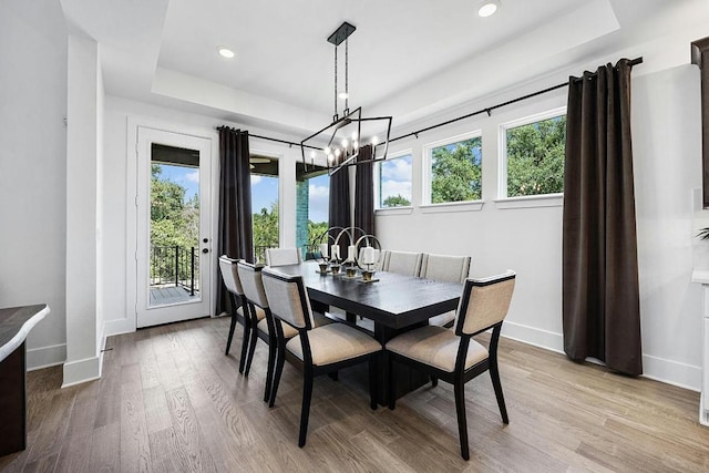 1220 Summer Moon Dr, Georgetown, TX 78628 - dining area featuring a raised ceiling, a chandelier, light wood finished floors, and recessed lighting