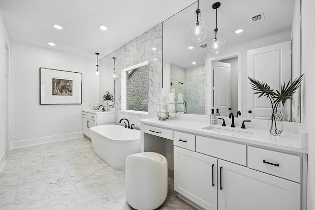 1220 Summer Moon Dr, Georgetown, TX 78628 - full bathroom featuring two vanities, a shower stall, a freestanding tub, recessed lighting, and marble finish floors