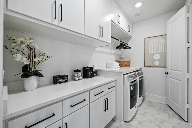 1220 Summer Moon Dr, Georgetown, TX 78628 - laundry room with washing machine and clothes dryer, cabinet space, light marble finish floors, and recessed lighting