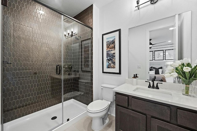 1220 Summer Moon Dr, Georgetown, TX 78628 - ensuite bathroom featuring vanity, a shower stall, and tile patterned floors