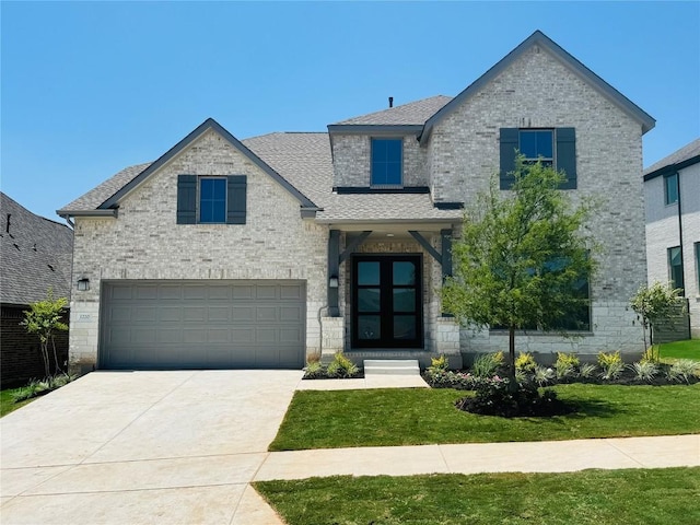 1220 Summer Moon Dr, Georgetown, TX 78628 - view of front facade with a garage, a front lawn, roof with shingles, driveway, and brick siding
