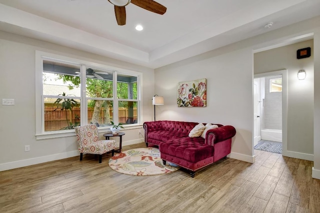 living room featuring baseboards, a ceiling fan, recessed lighting, and wood finished floors