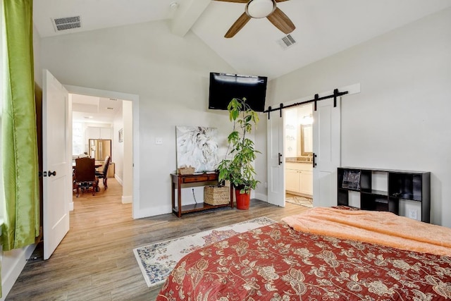bedroom featuring high vaulted ceiling, beamed ceiling, a barn door, and visible vents