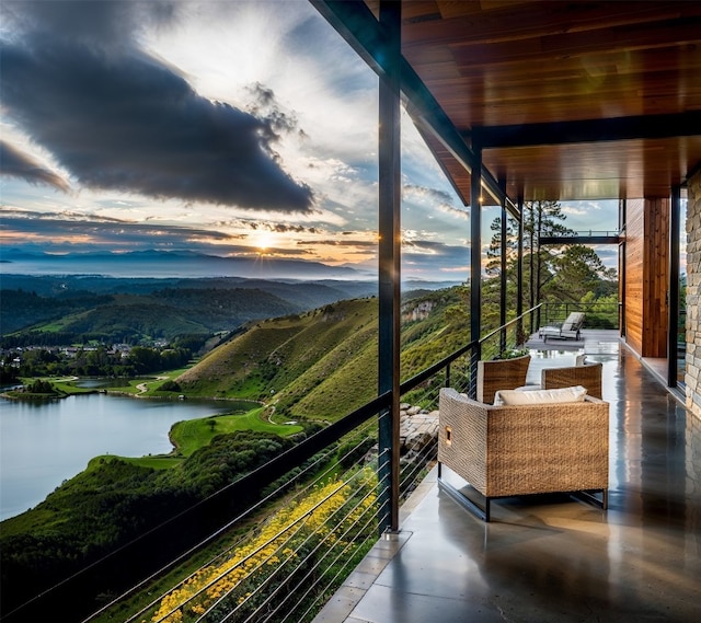 balcony featuring a water view
