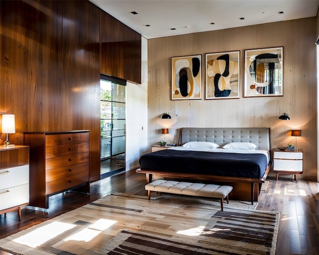 1806 Buffalo Gap Rd, Austin, TX 78734 - bedroom with wood finished floors and wooden walls