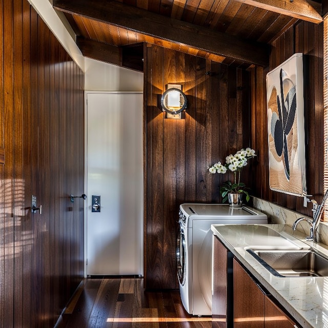 laundry room with a sink, wood ceiling, dark wood-style floors, and wood walls