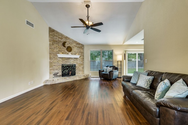 1307 S Meadows Dr, Austin, TX 78758 - living room featuring a ceiling fan, wood finished floors, high vaulted ceiling, a brick fireplace, and baseboards