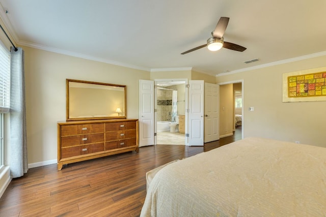 1307 S Meadows Dr, Austin, TX 78758 - bedroom featuring dark wood-style flooring, crown molding, baseboards, ensuite bath, and ceiling fan