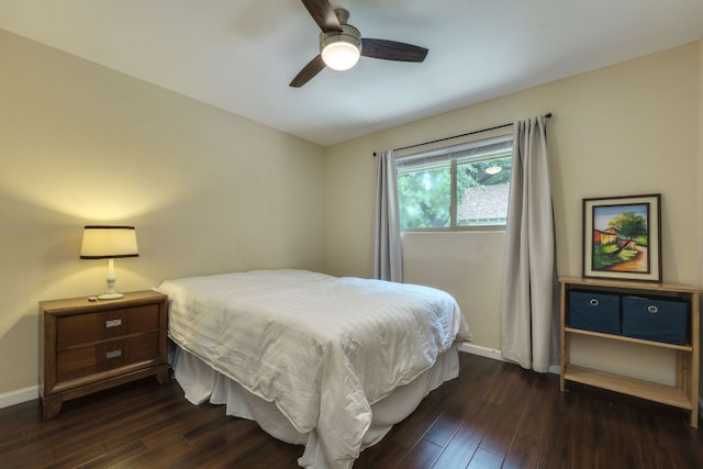 1307 S Meadows Dr, Austin, TX 78758 - bedroom featuring dark wood-type flooring, baseboards, and ceiling fan