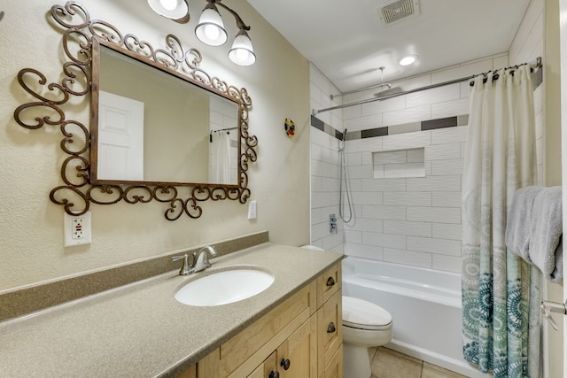 full bath featuring vanity, toilet, tile patterned floors, a combined bath / shower with rainfall shower, and visible vents