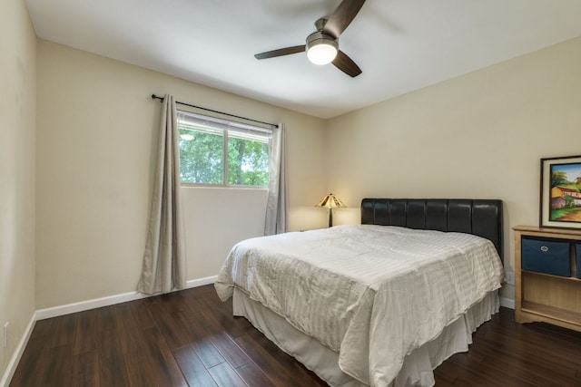 bedroom featuring baseboards, ceiling fan, and wood finished floors