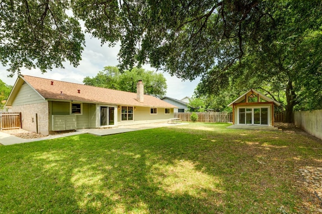 1307 S Meadows Dr, Austin, TX 78758 - rear view of house featuring a chimney, a patio, and brick siding