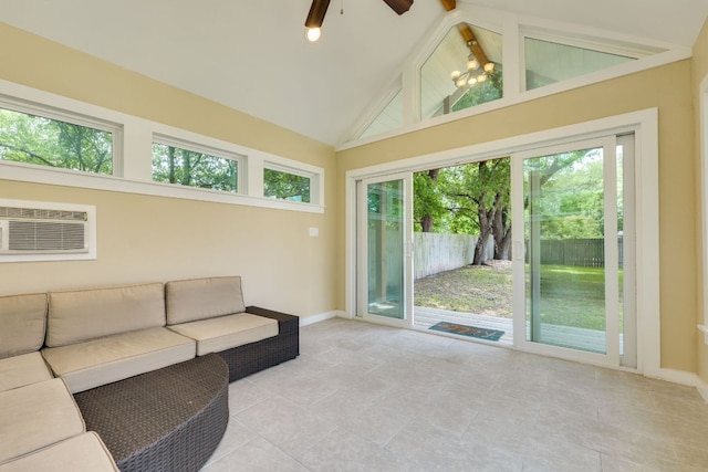 unfurnished living room with an AC wall unit, a ceiling fan, baseboards, and high vaulted ceiling