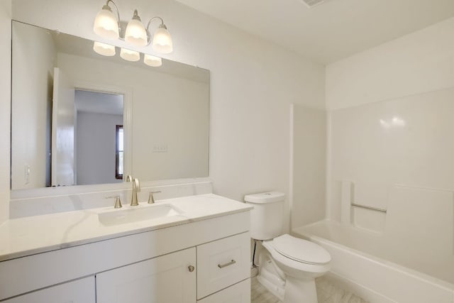 full bath featuring vanity and toilet