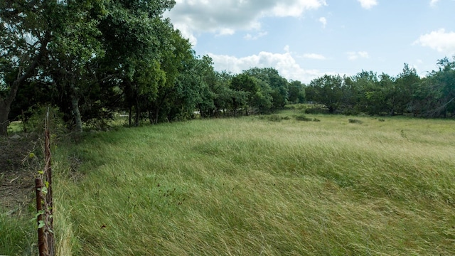 view of landscape featuring a forest view