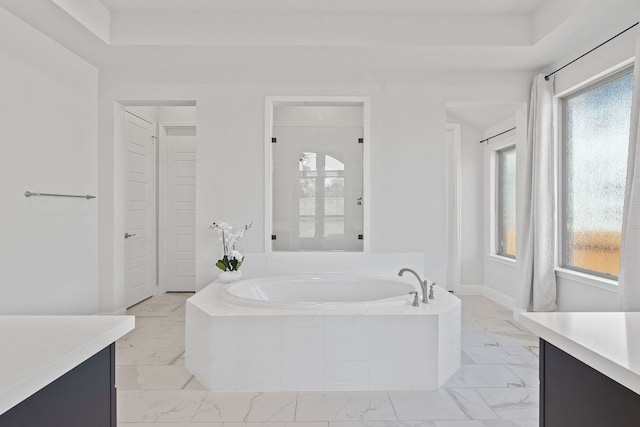1504 Caylea Bluff Ln, Georgetown, TX 78628 - full bath with vanity, a garden tub, and marble look tiles