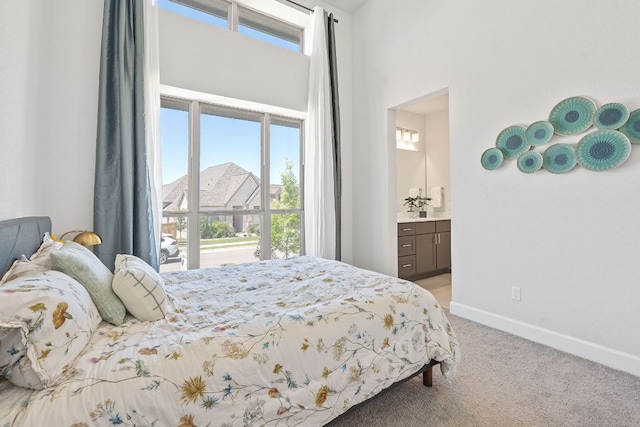1504 Caylea Bluff Ln, Georgetown, TX 78628 - bedroom with light colored carpet, a high ceiling, and connected bathroom