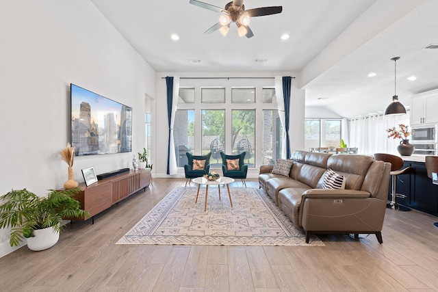 1504 Caylea Bluff Ln, Georgetown, TX 78628 - living area featuring light wood finished floors, a ceiling fan, recessed lighting, and lofted ceiling