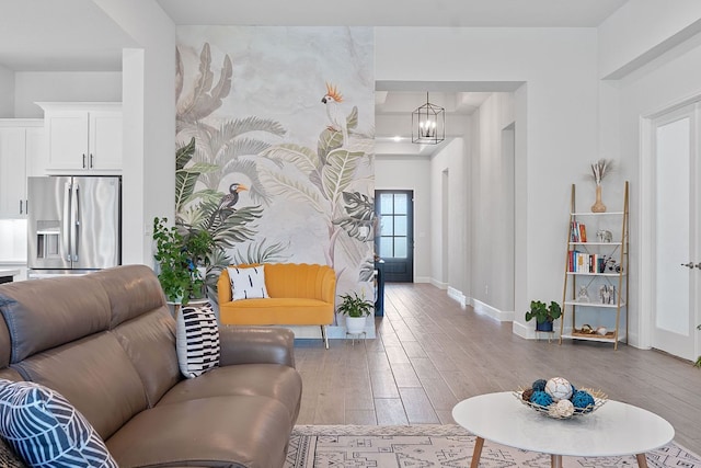 1504 Caylea Bluff Ln, Georgetown, TX 78628 - living room featuring wood finished floors and a chandelier