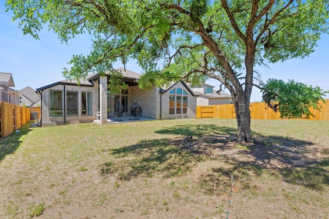 1504 Caylea Bluff Ln, Georgetown, TX 78628 - fenced backyard with a patio area
