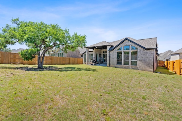 1504 Caylea Bluff Ln, Georgetown, TX 78628 - rear view of house featuring a fenced backyard and brick siding