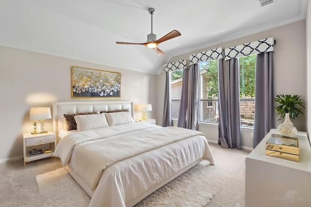 carpeted bedroom featuring baseboards, ornamental molding, ceiling fan, and lofted ceiling