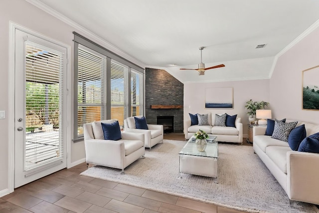 12509 Morelia Way, Austin, TX 78748 - living area with a ceiling fan, a stone fireplace, visible vents, crown molding, and lofted ceiling