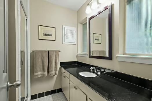 bathroom featuring tile patterned flooring and vanity
