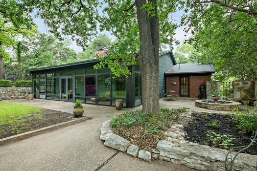 back of house featuring a sunroom