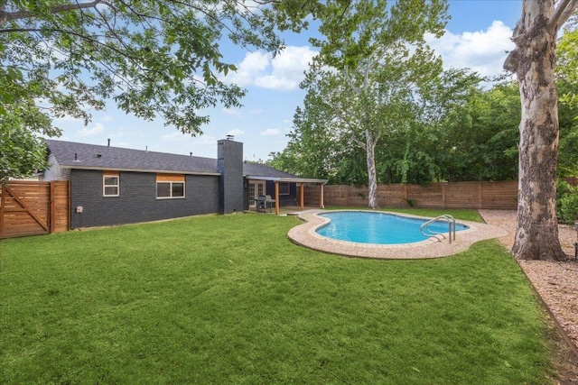 view of swimming pool featuring a fenced backyard, a fenced in pool, a yard, and a patio area