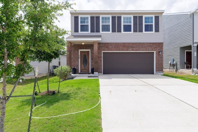 traditional-style home featuring an attached garage, a front yard, driveway, and brick siding
