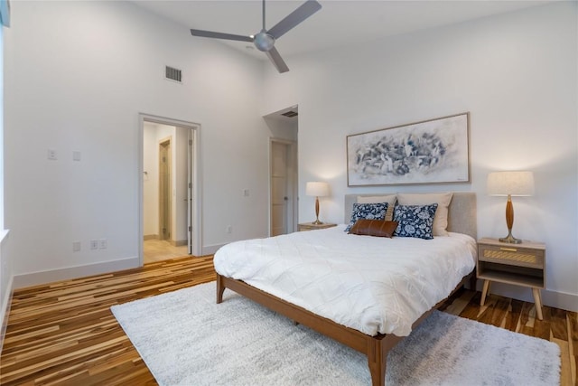 2902 Cedarview Dr, Austin, TX 78704 - bedroom featuring ensuite bath, high vaulted ceiling, baseboards, wood finished floors, and visible vents