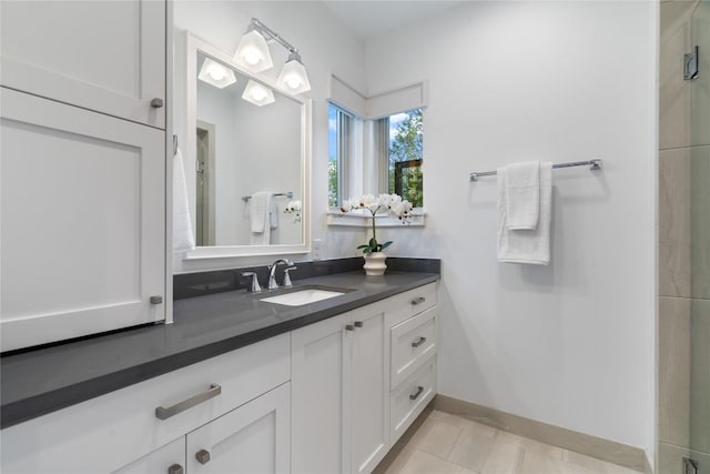 2902 Cedarview Dr, Austin, TX 78704 - bathroom with vanity, baseboards, and tile patterned flooring
