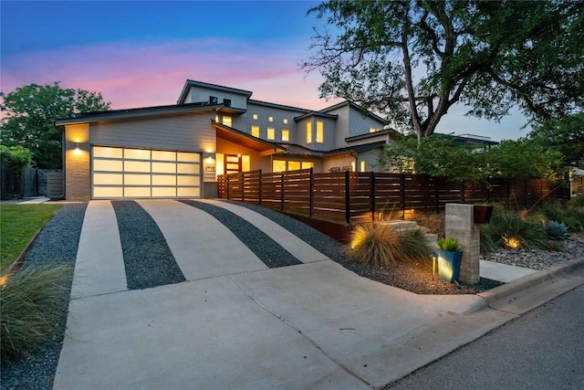 2902 Cedarview Dr, Austin, TX 78704 - contemporary home with an attached garage, fence, and concrete driveway