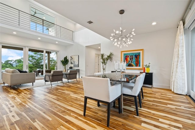 2902 Cedarview Dr, Austin, TX 78704 - dining room featuring an inviting chandelier, recessed lighting, light wood-style flooring, and visible vents