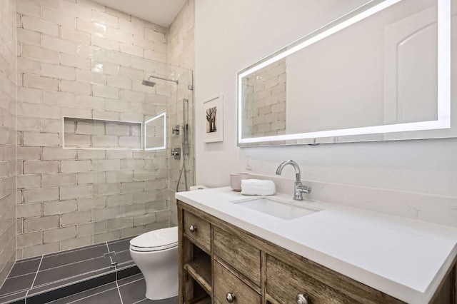 full bath featuring a walk in shower, tile patterned flooring, vanity, and toilet