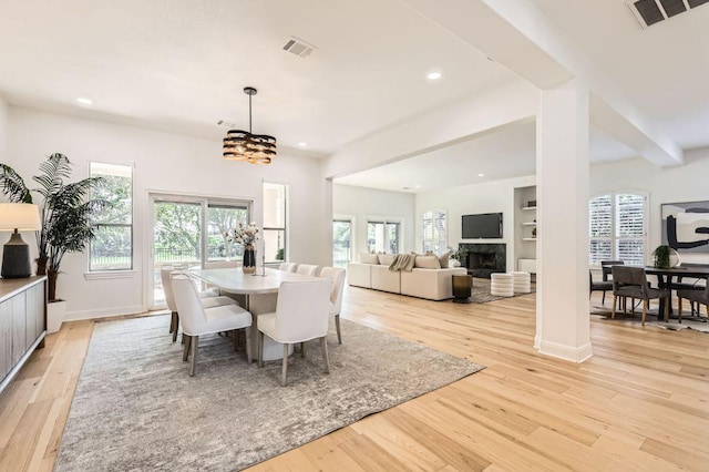dining area with recessed lighting, visible vents, plenty of natural light, and light wood-type flooring