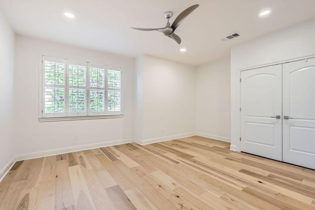 unfurnished bedroom featuring visible vents, recessed lighting, light wood-style floors, and baseboards