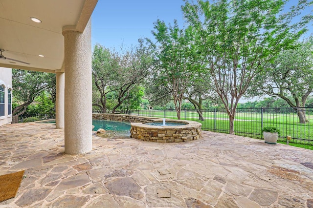 view of patio / terrace featuring fence, a ceiling fan, and a fenced in pool