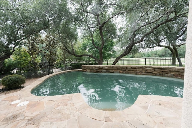 view of pool with a patio, a fenced in pool, and a fenced backyard