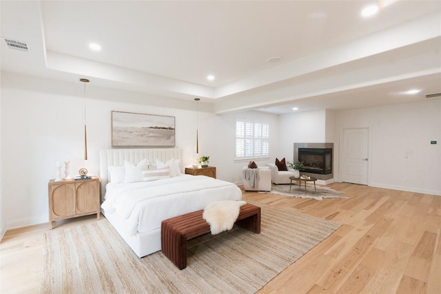 bedroom with recessed lighting, visible vents, and light wood finished floors