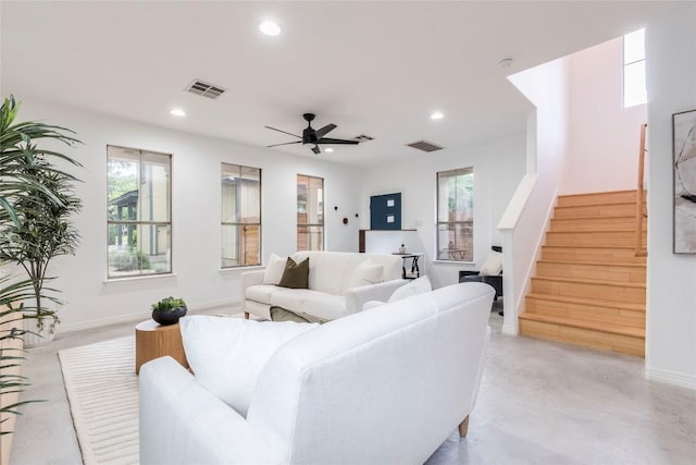 living room featuring stairs, recessed lighting, and visible vents
