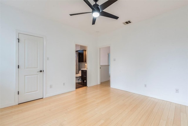interior space with ceiling fan, visible vents, and light wood-type flooring
