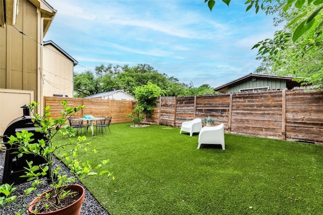 view of yard with a fenced backyard