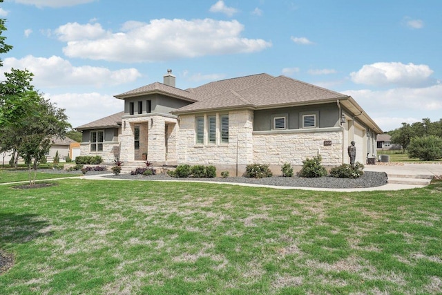prairie-style home featuring a chimney, stucco siding, a front yard, and stone siding