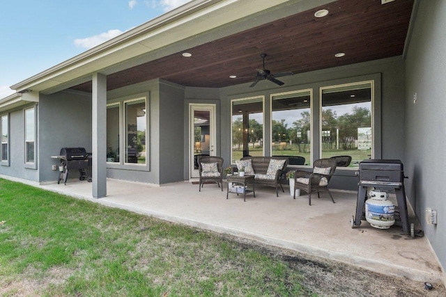 exterior space with area for grilling, ceiling fan, and outdoor lounge area