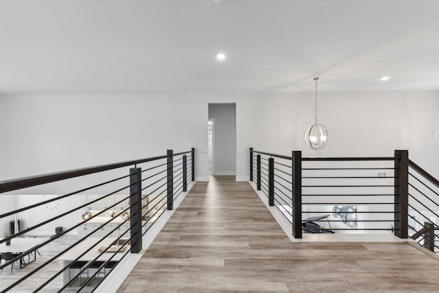 4617 Port Genova Ct, Leander, TX 78641 - hallway featuring a chandelier, wood finished floors, recessed lighting, and an upstairs landing