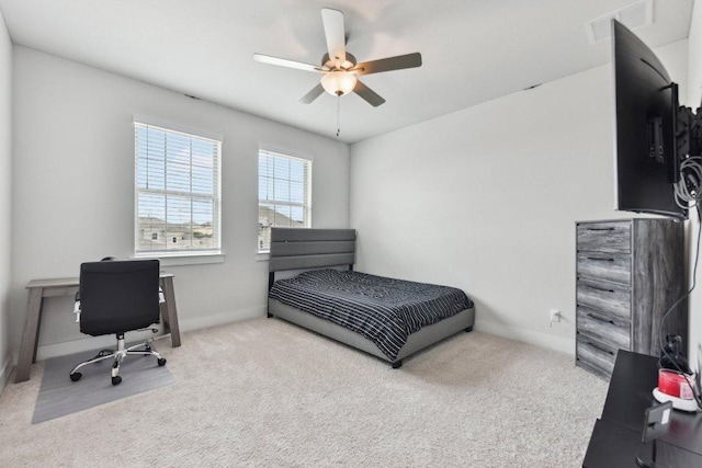 bedroom featuring baseboards, ceiling fan, and carpet