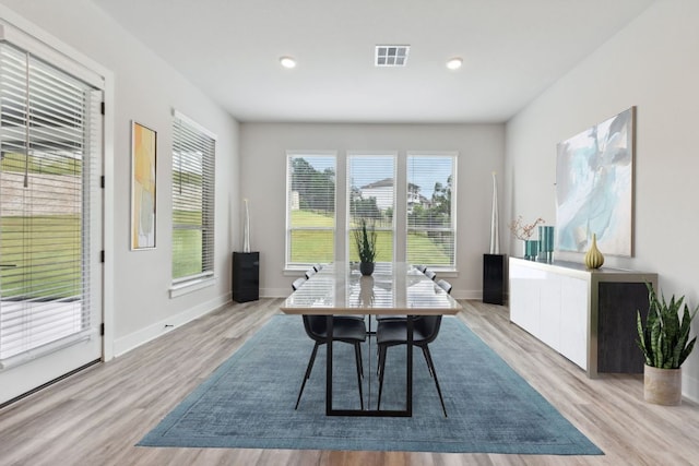 office space featuring recessed lighting, baseboards, visible vents, and light wood-type flooring